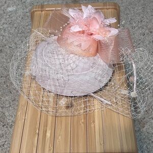 Elegant Pink Fascinator with Floral Accent